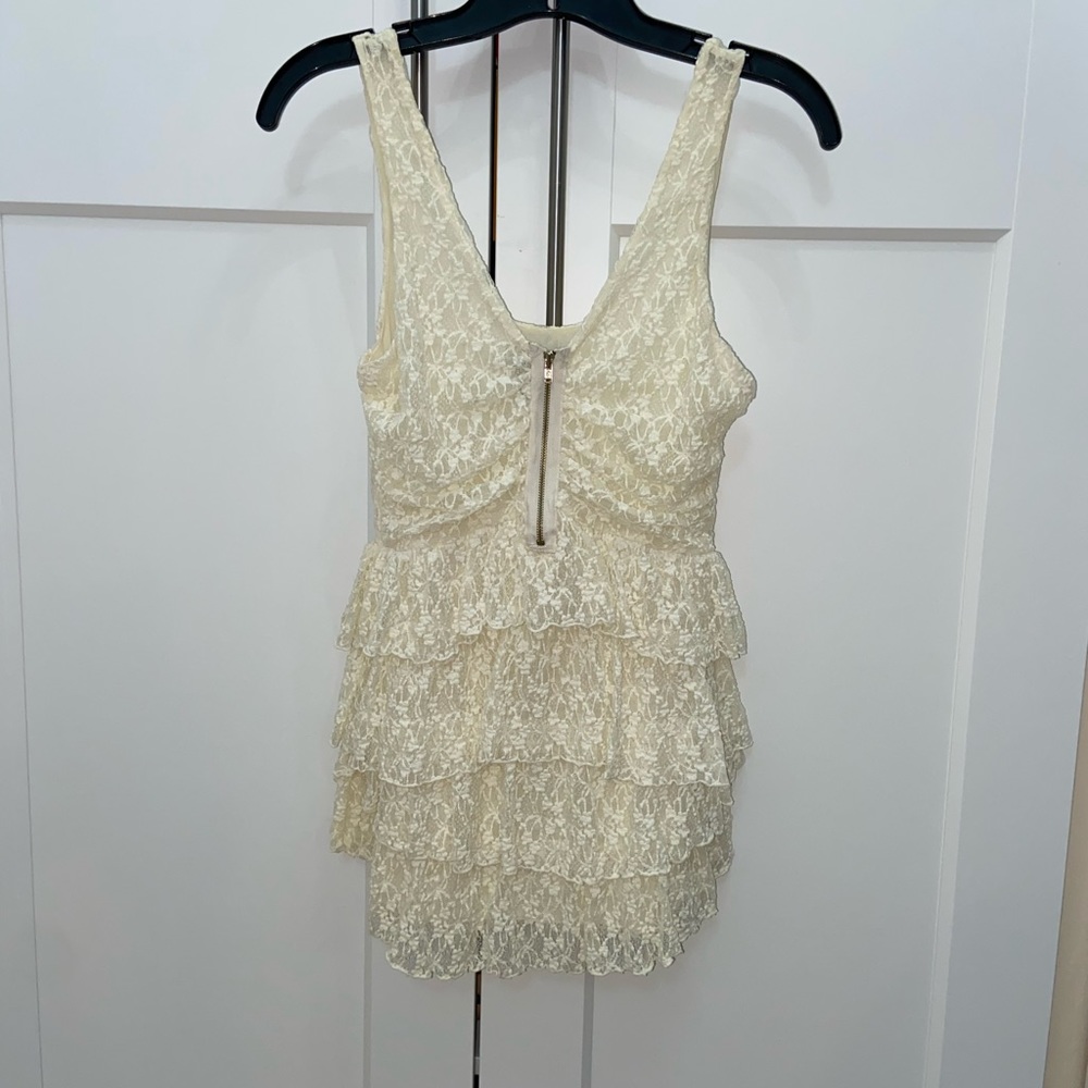 Moda International cream peplum ruffle top